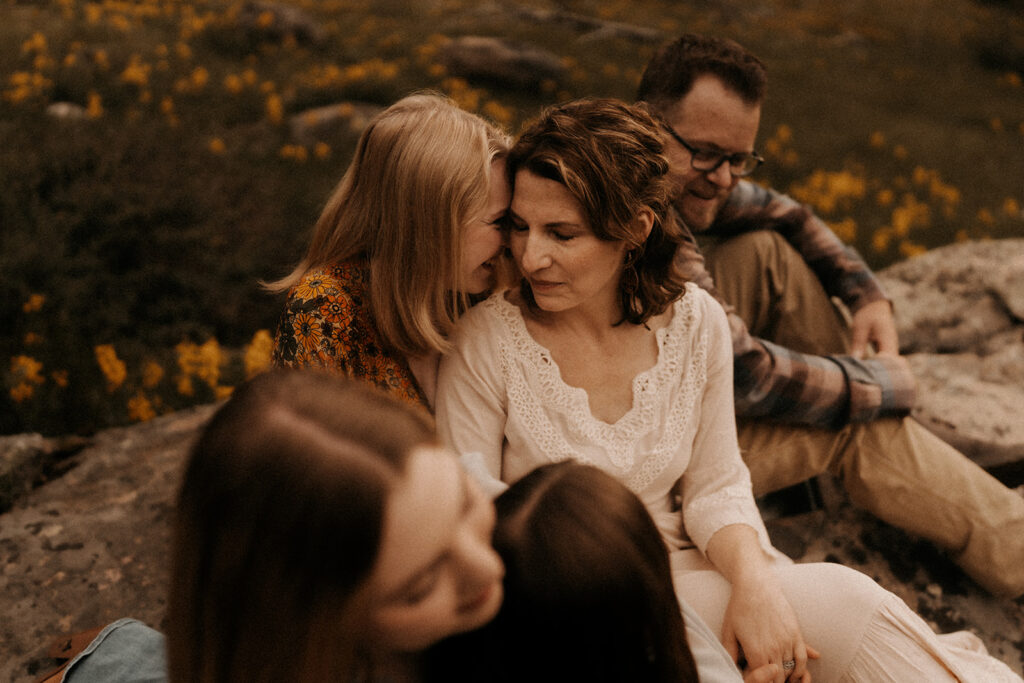 a family posing for a photoshoot at lake granby in Colorado - colorado family photography

