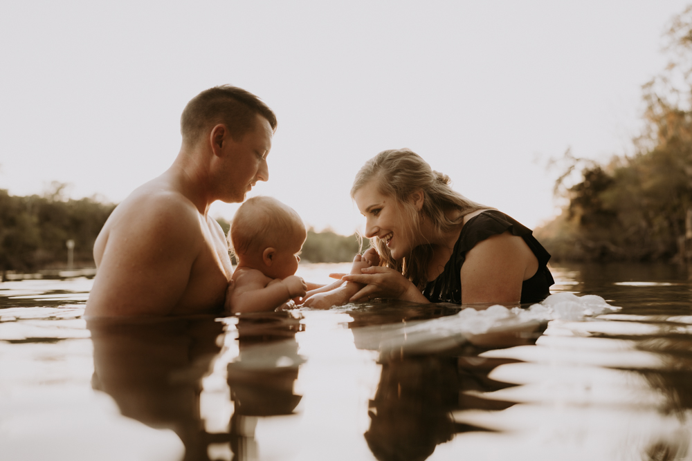 family posing in water with gorgeous outfit styling